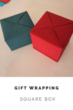 an origami box sitting on top of a table with the text gift wrapping square box