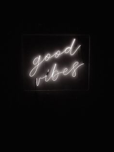 a neon sign that says good vibes on it