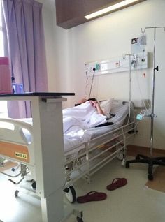 a hospital room with a bed and medical equipment