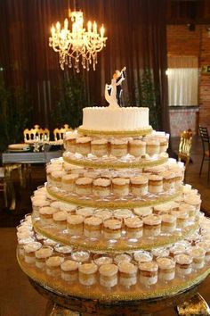 a wedding cake made out of cupcakes