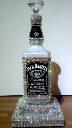 a bottle of jack daniels whiskey sitting on top of a table