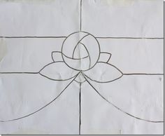 a piece of paper that has been drawn with lines and a flower on top of it