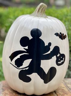 a mickey mouse pumpkin sitting on top of a table