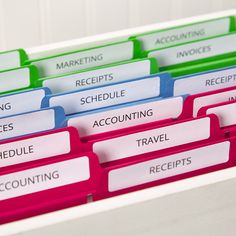 colorful file folders with labels on them that say receipts, schedules, and travel