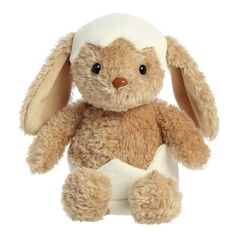 a small stuffed rabbit with a white hat on its head and ears, sitting up against a white background