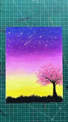 a piece of paper that has been made to look like a tree with stars in the sky