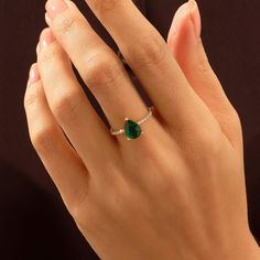 Make a statement of unparalleled beauty with our Pear Cut Emerald Ring. The mesmerizing pear-shaped emerald, with its rich and velvety green color, is the focal point of this exquisite ring. Whether worn as an engagement ring or a striking accessory, the pear cut and sparkling details make it a timeless and unforgettable addition to any jewelry collection. - Decorated with handset white cubic zirconia stone - Pear cut lab-grown emerald- Made in 14k solid gold - Band Width: 1.53 mm \ 0.060 inches