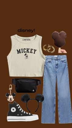 a mickey mouse shirt, jeans and sneakers