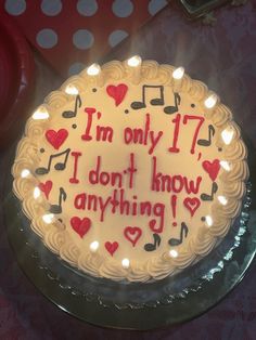 a birthday cake with musical notes and hearts on it that says i'm only 17 i don't know anything