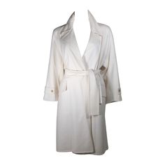 This coat is composed of an ultra supple cashmere in a beautiful brilliant shade of white. There are front pocket details and a belt closure. Excellent condition with original tag. Made in France. Please feel to contact us with any inquiries you may have. We also offer convenient layaway options. **Please cross-reference measurements for personal accuracy. Measures (Approximately) Length: 41" Sleeve: 23 Shoulder to Shoulder: 15.5" Bust: 40" Waist: 48" Hip: 48" Pink Trench Coat, Trench Jacket, Pink Coat, Belted Trench Coat, Fashion Wishlist, Heritage Fashion, White Coat, Pink Jacket, Outerwear Coats