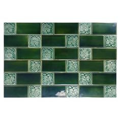 green and white tile with flowers on it