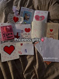 a pile of valentine's day cards on a bed with the words priceless gifts