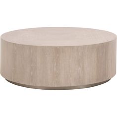 a round wooden table sitting on top of a white floor