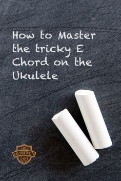 two white crayons sitting next to each other on a black surface with the words how to master the tricky e chords on the ukulele