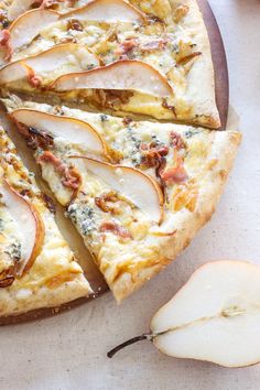 an apple and cheese pizza is cut into slices