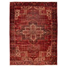 a red rug with an intricate design on the front and back end, in different colors