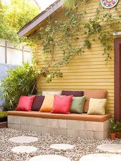 a yellow house with lots of pillows on it