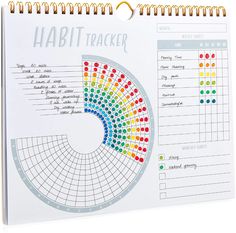 a spiral bound habit tracker on a white background