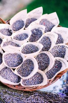 a basket filled with lavender seeds on top of a table