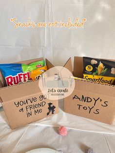 three boxes filled with candy sitting on top of a table