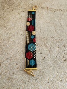 a beaded bracelet is laying on the floor