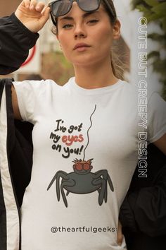 a woman wearing a t - shirt that says i'm got my eyes on you