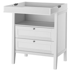 a white cabinet with two drawers on the bottom and one drawer at the top that is open