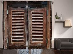 an old wooden door with shutters open