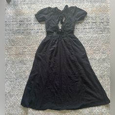 This Stunning Free People Dress Is A Must-Have For Any Fashion-Forward Woman. The Beautiful Floral Pattern And Intricate Embroidery Details Make It A Perfect Choice For A Party Or Formal Occasion. The Dress Features A V-Neckline, Short Cap Sleeves, And An Open Back Design That Adds A Touch Of Bohemian Style. Made Of 100% Cotton With A Lace Fabric Type, This Long Maxi Dress Is Comfortable And Perfect For The Summer Or Spring Season. It Comes In A Size M And Has A Pullover Closure. The Dress Is No Black Tie Back Maxi Dress For Brunch, Black Maxi Dress With Tie Back For Brunch, Black Midi Dress With Tie Back For Day Out, Casual Midi Dress With Lace Trim For Date Night, Black Midi Length Dress With Tie Back, Spring Black Dress With Tie Back, Black Cotton Dress For Brunch, Black Tie Back Dress For Spring, Casual Black Cotton Dress For Brunch