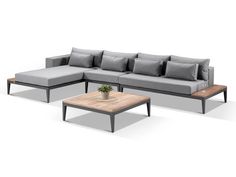 a couch and coffee table sitting next to each other on a white surface with grey cushions