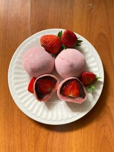 some strawberries are on a white plate