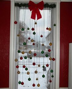 a christmas tree made out of ornaments in front of a window with the words, great idea