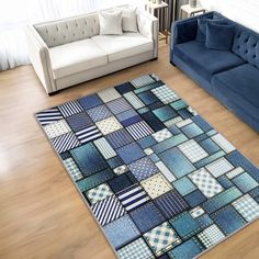 a living room with couches and rugs on the floor