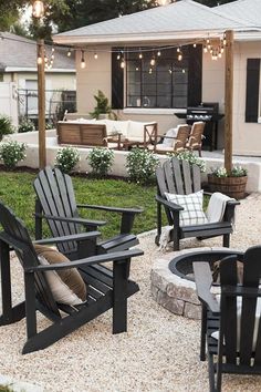 an outdoor patio with chairs and fire pit