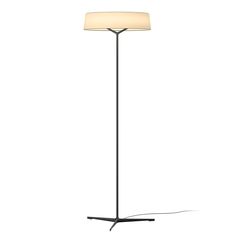 a floor lamp with a white shade on it's base and a black stand