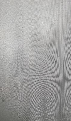 a black and white photo of the back side of a television screen with lines on it