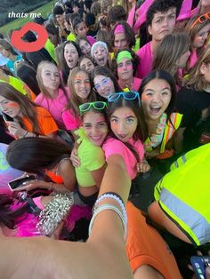 a group of young people standing next to each other wearing neon colored shirts and sunglasses