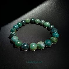 -This Natural Moss Agate Bracelet Is A Beautiful And Unique Accaccessoryessory Is Perfect For Both Men And Women. The Bracelet Features High-Quality Green Beads That Are All Natural. The Unisex Design Of The Bracelet Makes It A Versatile Accessory That Can Be Worn By Anyone, Regardless Of Gender. Send Me A Message To Request Bracelet Length From 6.5 To 8.5 Inches. Standard Length Is 7.5 Inches. -The Bracelet Is Available In Two Sizes, 8mm And 10mm, Providing Options For Those Who Prefer A Smalle Moss Agate Bracelet, Green Beaded Bracelets, Green Beads, Agate Bracelet, Nature Bracelets, Beaded Stretch Bracelet, Green Bead, Moss Agate, Accessories Unique