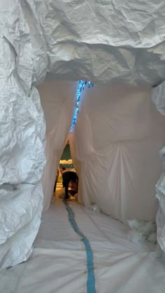 there is a tunnel made out of white paper