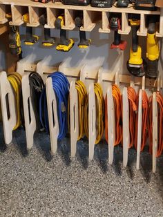 many different types of tools are hanging on the wall