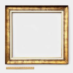 a gold frame with a ruler next to it