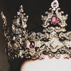 a close up of a crown on top of a person's head