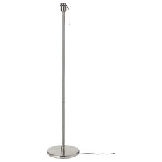 a lamp that is on top of a metal stand with a cord attached to it