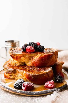 french toast stacked on top of each other with berries