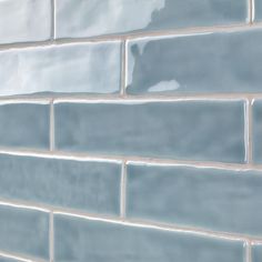 a close up view of a blue brick wall