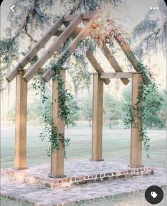 a wooden structure with greenery on it