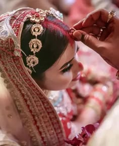 a bride getting ready for her wedding ceremony