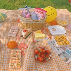 a picnic table with food and drinks on it