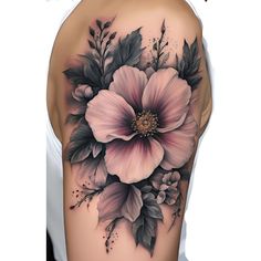 the back of a woman's shoulder with flowers and leaves on her left arm