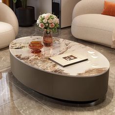 a coffee table with flowers on it in a living room